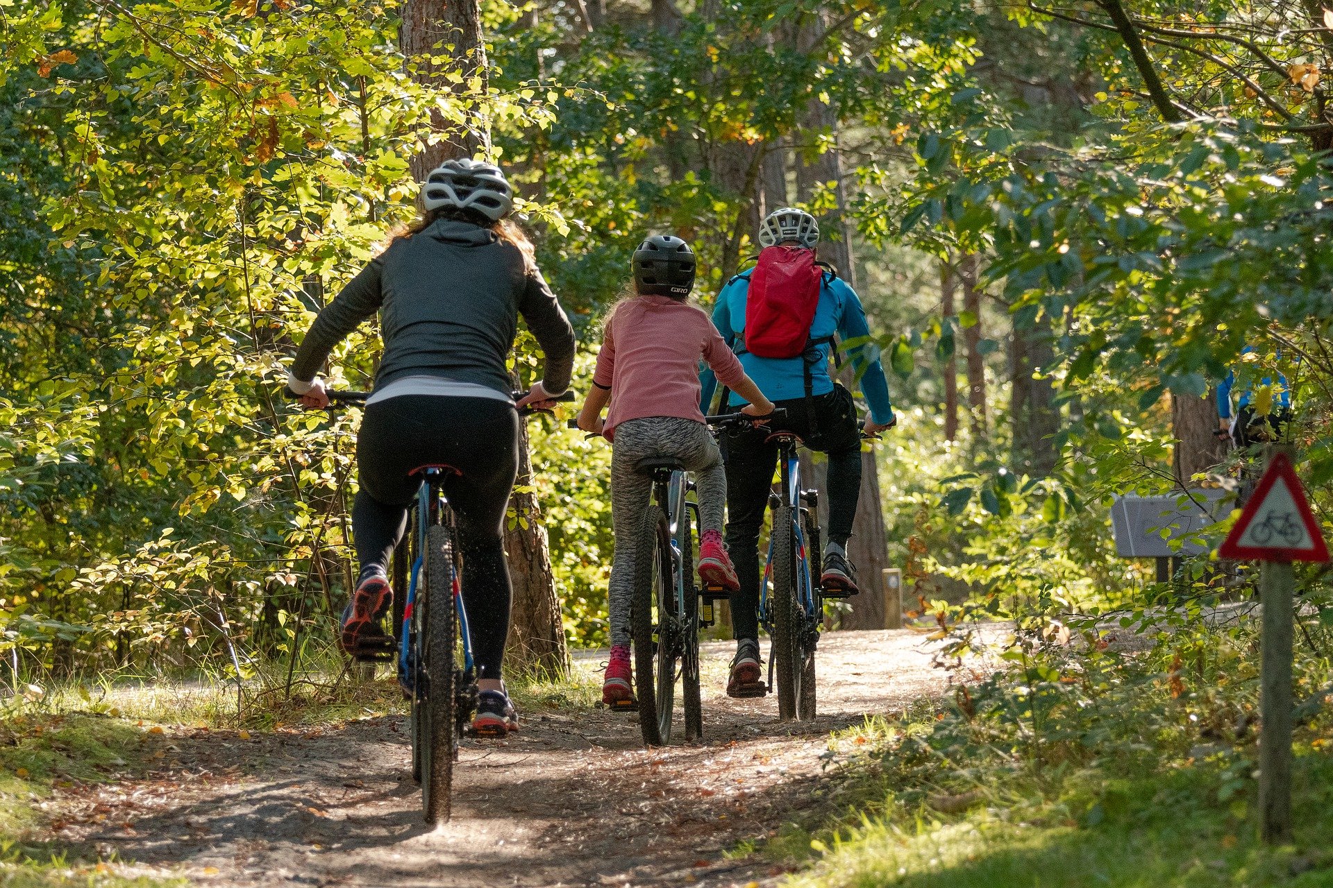 A family biking on a trail together