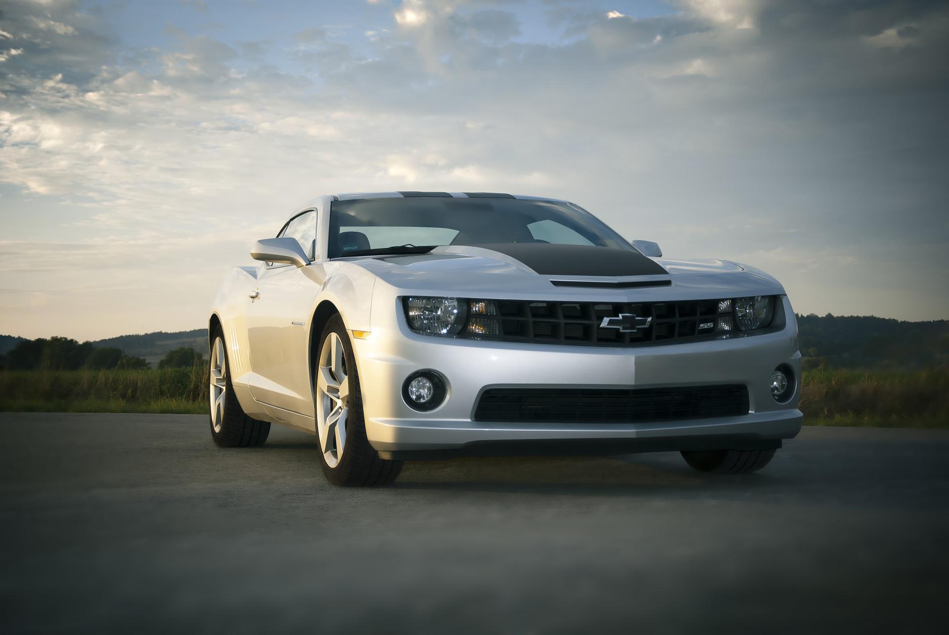 A silver Chevrolet driving on the road