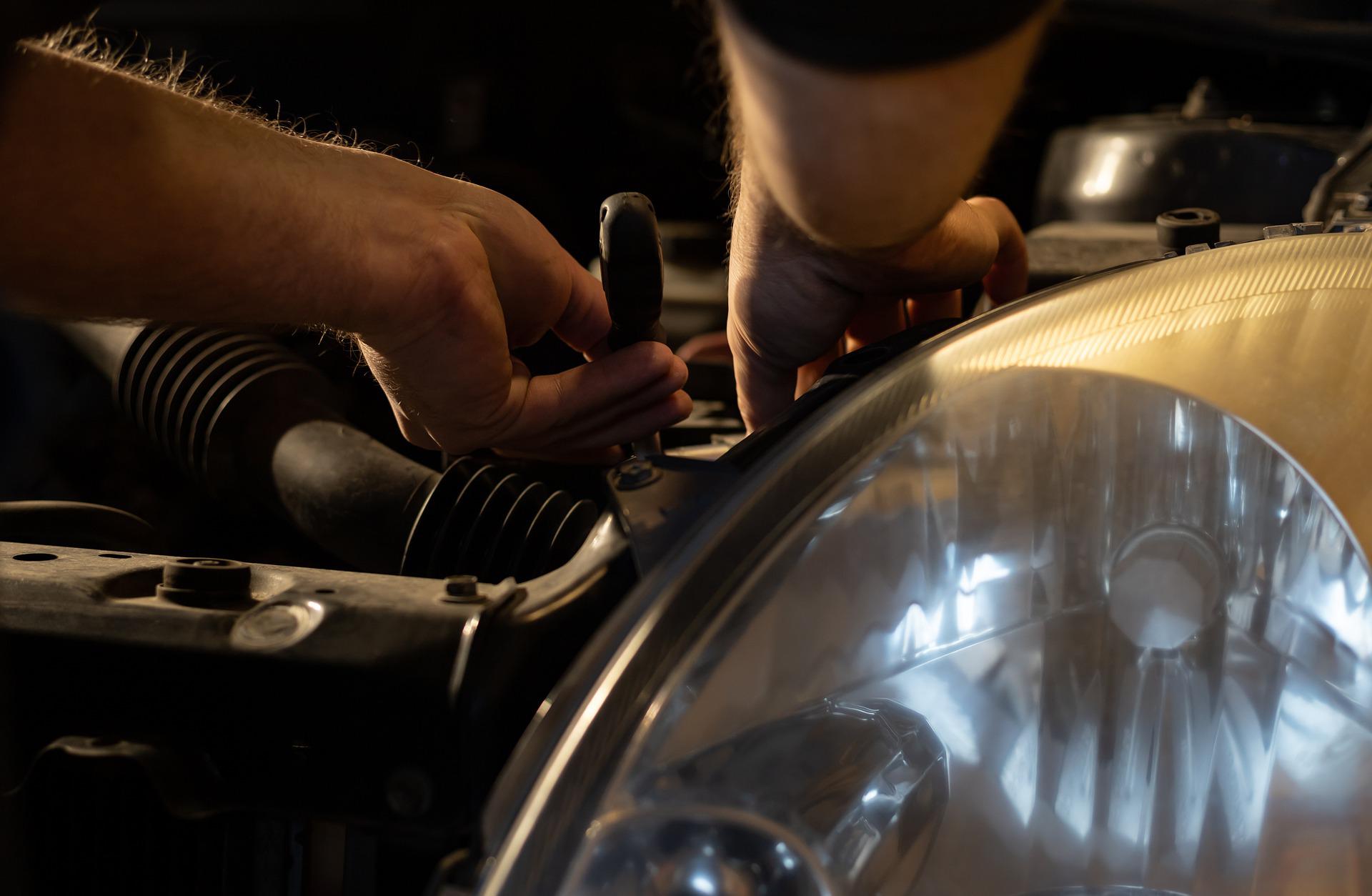 A mechanic repairing a vehicle
