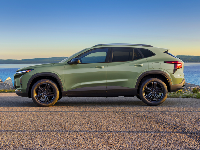 A green Chevy Trax parked by the ocean